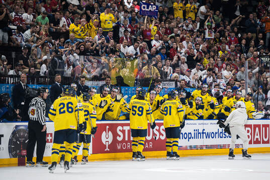 Carl Grundström of Sweden celebrates with team mates