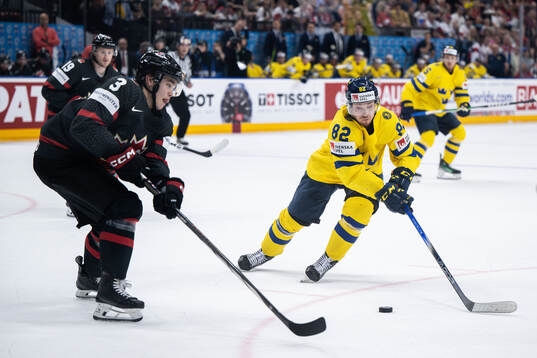 Olen Zelwegger of Canada and Jesper Frödén of Sweden