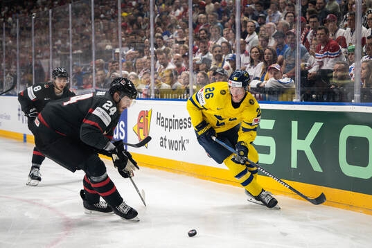 Jamie Oleksiak of Canada and Rasmus Dahlin of Sweden