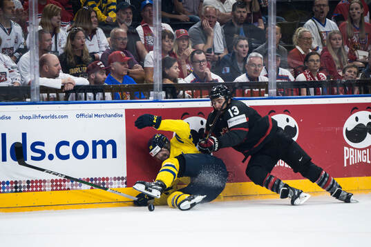 Linus Johansson of Sweden and Brandon Tanev of Canada