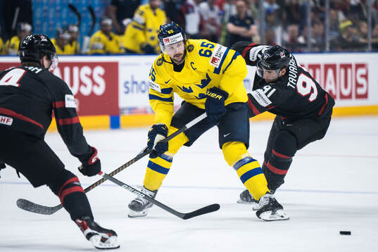 Erik Karlsson of Sweden and John Tavares of Canada