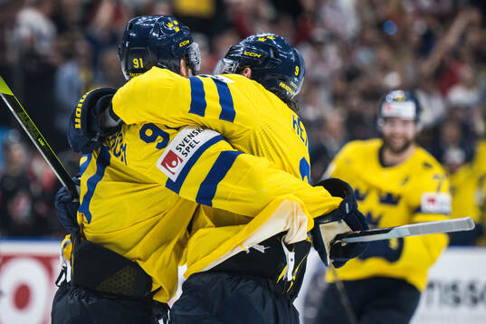Carl Grundström and Adrian Kempe of Sweden celebrates