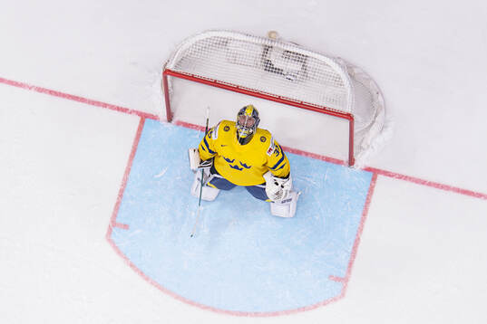 goaltender Filip Gustavsson of Sweden celebrates