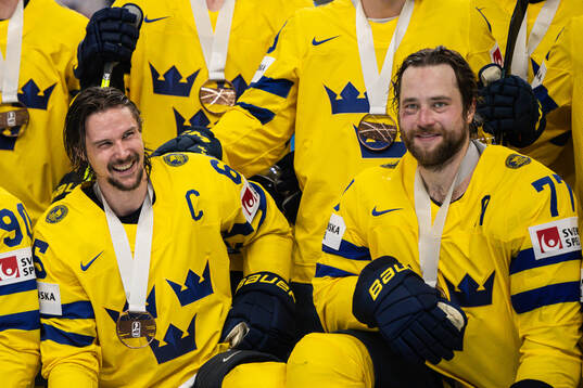 Erik Karlsson and Victor Hedman of Sweden celebrate with