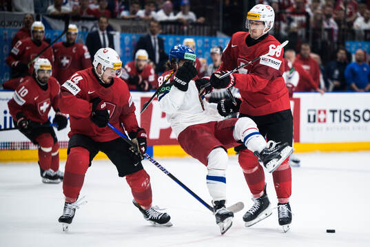 David Pastrnak of Czech Republic and Fabrice Herzog of