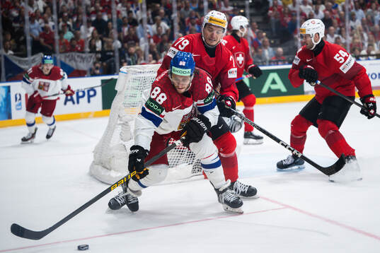 David Pastrnak of Czech Republic and Calvin Thurkauf of