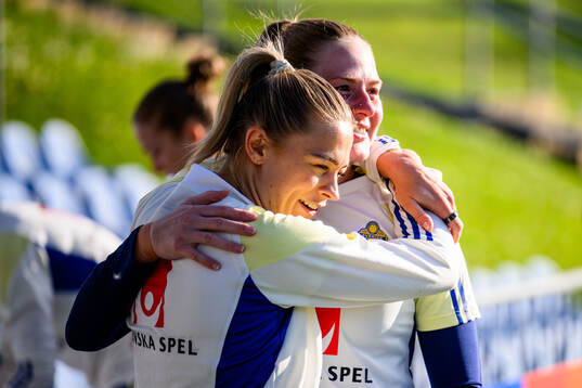 Fridolina Rolfö and Goalkeeper Tove Enblom of Sweden at a