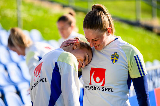 Fridolina Rolfö and Goalkeeper Tove Enblom of Sweden at a