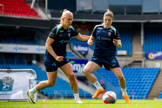 Maria Thorisdottir and Maren Mjelde of the Norwegian