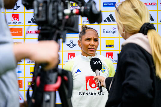 Madelen Janogy of Sweden is interviewed by the media