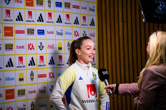 Kosovare Asllani of Sweden is interviewed by the media at a