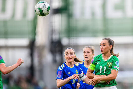Kosovare Asllani of Sweden and Katie McCabe of Ireland