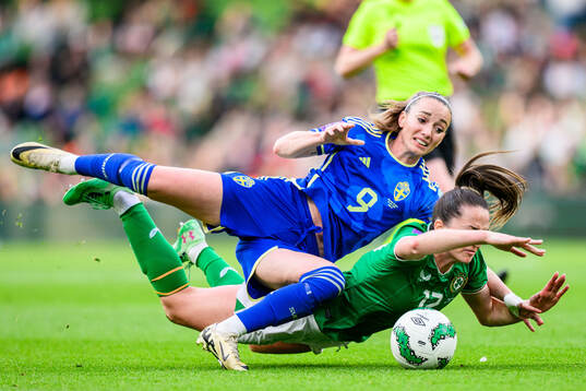 Kosovare Asllani of Sweden and Anna Patten of Ireland