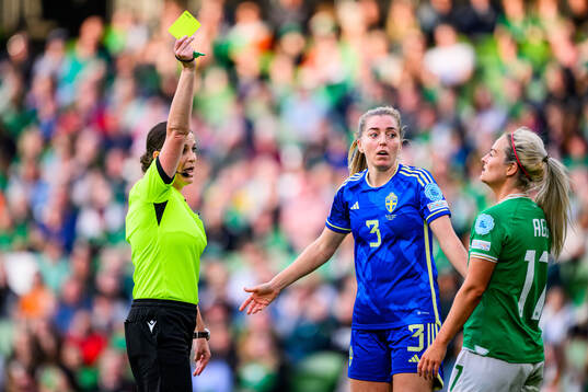 Referee Katalin Kulcsár, Linda Sembrant of Sweden and Lily