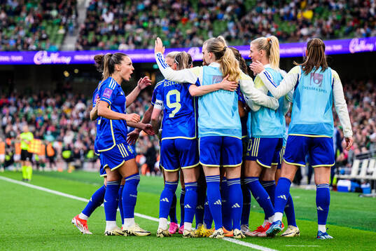 Fridolina Rolfö of Sweden celebrates with team mates