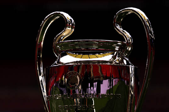 The Champions League trophy is displayed inside the stadium