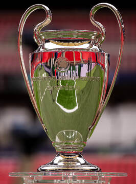 The Champions League trophy is displayed inside the stadium