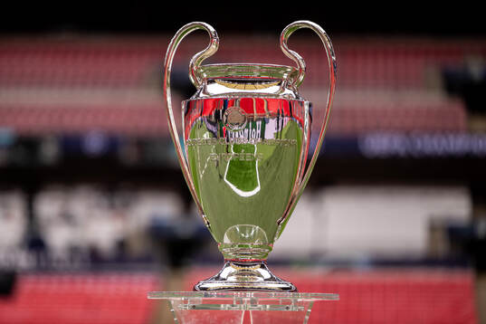 The Champions League trophy is displayed inside the stadium