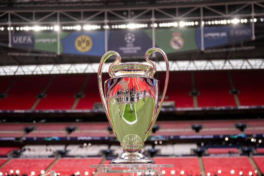 The Champions League trophy is displayed inside the stadium
