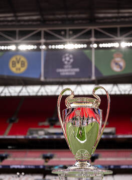 The Champions League trophy is displayed inside the stadium