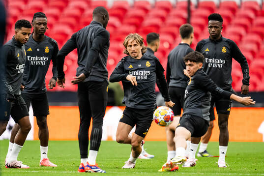 Luka Modric and Vinicius Junior of Real Madrid
