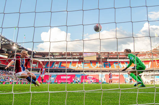 Mathilde Harviken of Norway clears the ball off the line