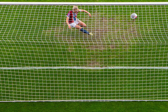 Mathilde Harviken of Norway clears the ball off the line