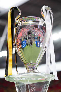 The Champions League trophy is displayed inside the stadium