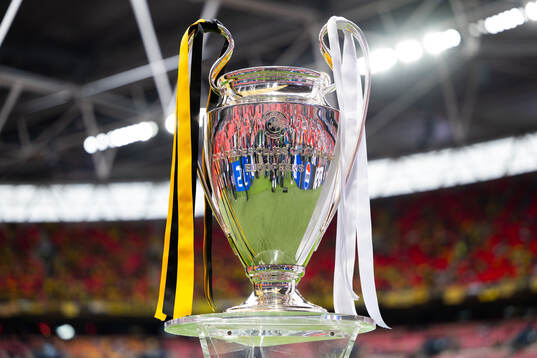 The Champions League trophy is displayed inside the stadium