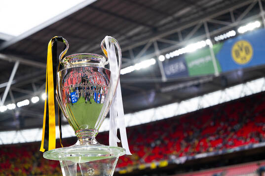 The Champions League trophy is displayed inside the stadium