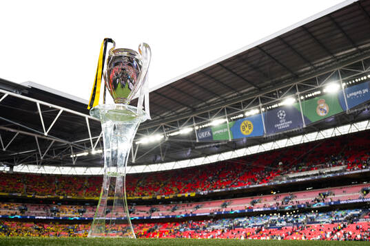 The Champions League trophy is displayed inside the stadium