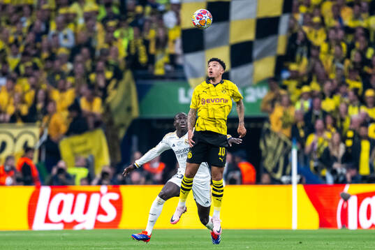 Ferland Mendy of Real Madrid and Jadon Sancho of Dortmund