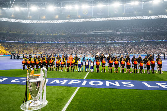 Players of Dortmund and Real Madrid