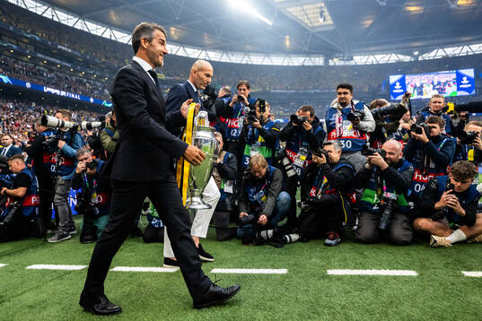 Former players Karl Heinz Riedle and Zinedine Zidane carry