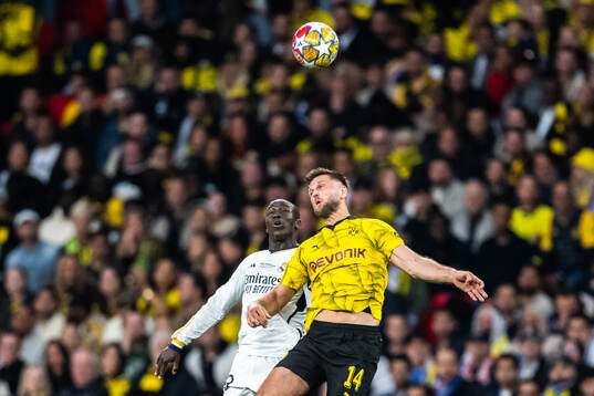 Ferland Mendy of Real Madrid and Niclas Fullkrug of Dortmund