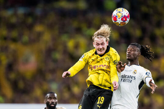 Julian Brandt of Dortmund and Eduardo Camavinga of Real