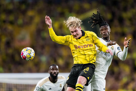 Julian Brandt of Dortmund and Eduardo Camavinga of Real