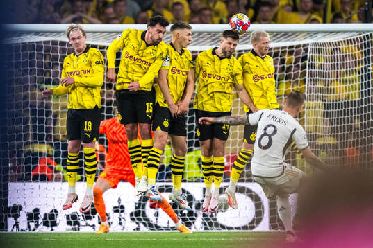 Toni Kroos of Real Madrid and Julian Brandt, Mats Hummels,
