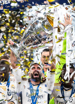 Dani Carvajal of Real Madrid lifts the trophy and celebrate