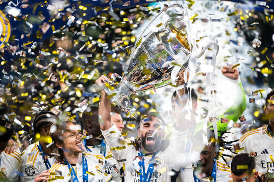 Dani Carvajal of Real Madrid lifts the trophy and celebrate