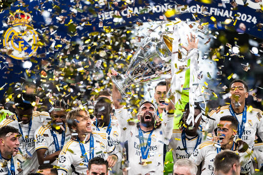 Dani Carvajal of Real Madrid lifts the trophy and celebrate