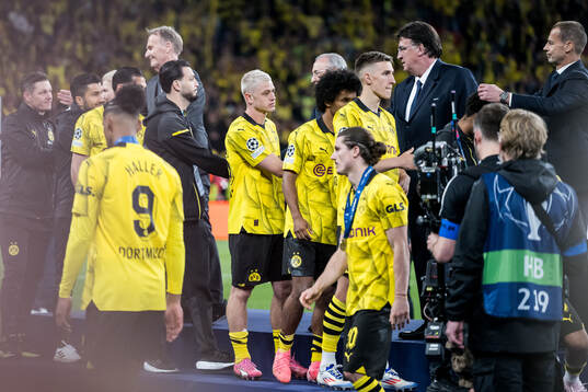 Julian Ryerson of Dortmund looks dejected