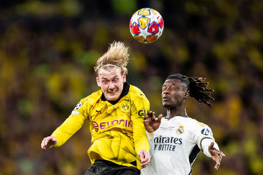 Julian Brandt of Dortmund and Eduardo Camavinga of Real