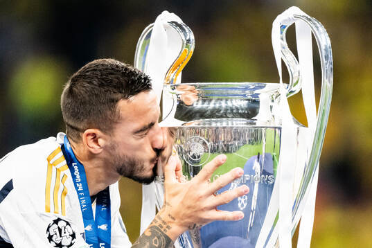 Dani Ceballos of Real Madrid and the trophy
