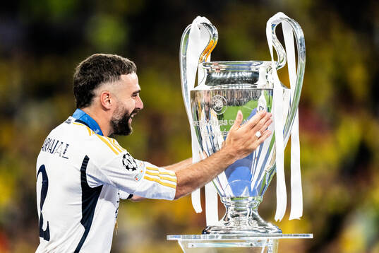 Dani Carvajal of Real Madrid and the trophy