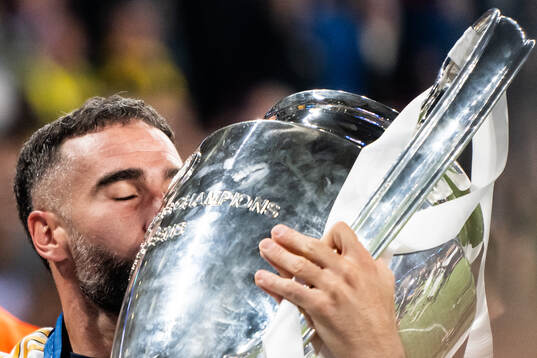 Dani Carvajal of Real Madrid celebrates with the trophy