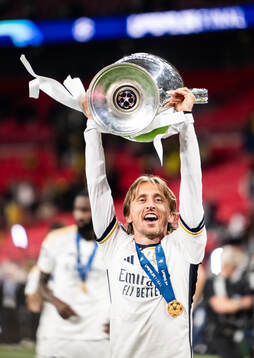 Luka Modric of Real Madrid celebrates with the trophy