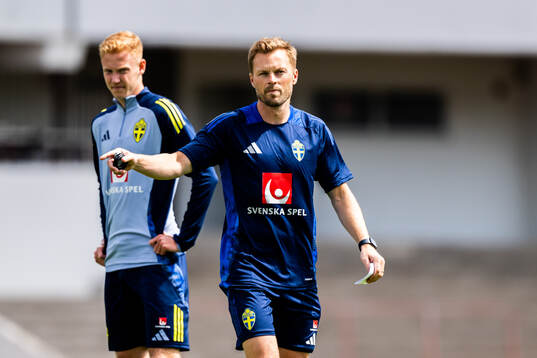 Hugo Larsson and assistant coach Sebastian Larsson of the