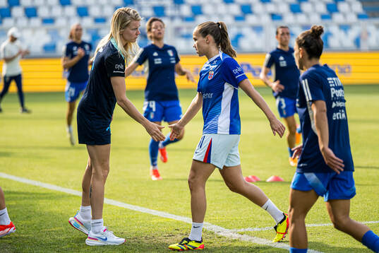 Ada Stolsmo Hegerberg and Guro Reiten of Norway