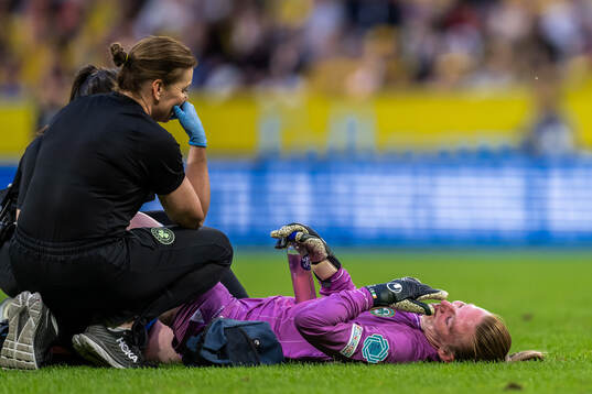Goalkeeper Courtney Brosnan of Republic of Ireland in pain